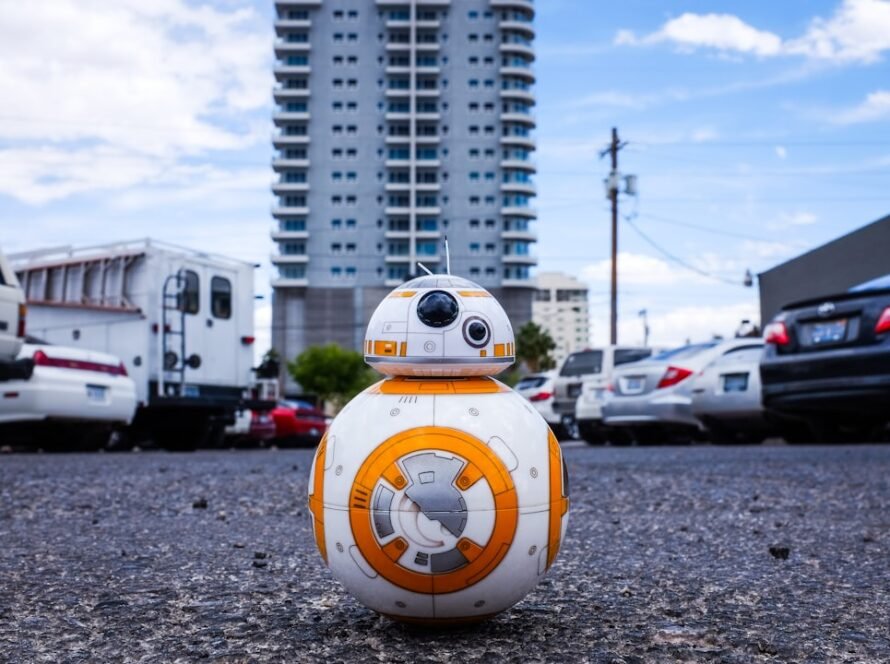 8CLICKS| a toy robot in a parking lot
