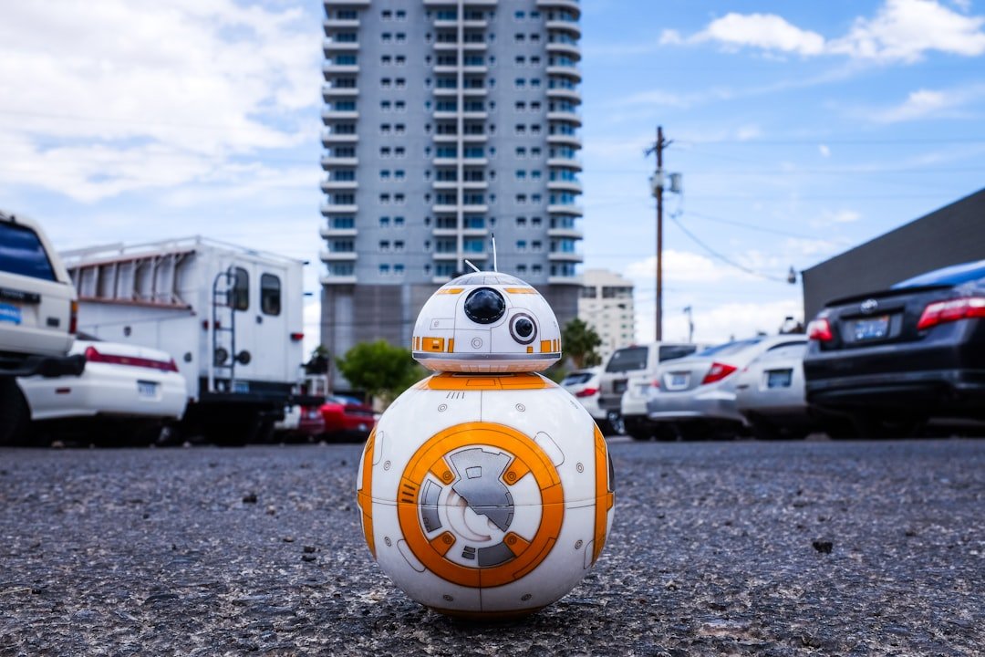 8CLICKS| a toy robot in a parking lot